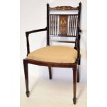 Edwardian inlaid armchair, spindle back, serpentine apron, tapering supports with spade feet,