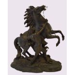 After Coustou, large patinated bronze study of leaping stallion and handler, base bears signature,