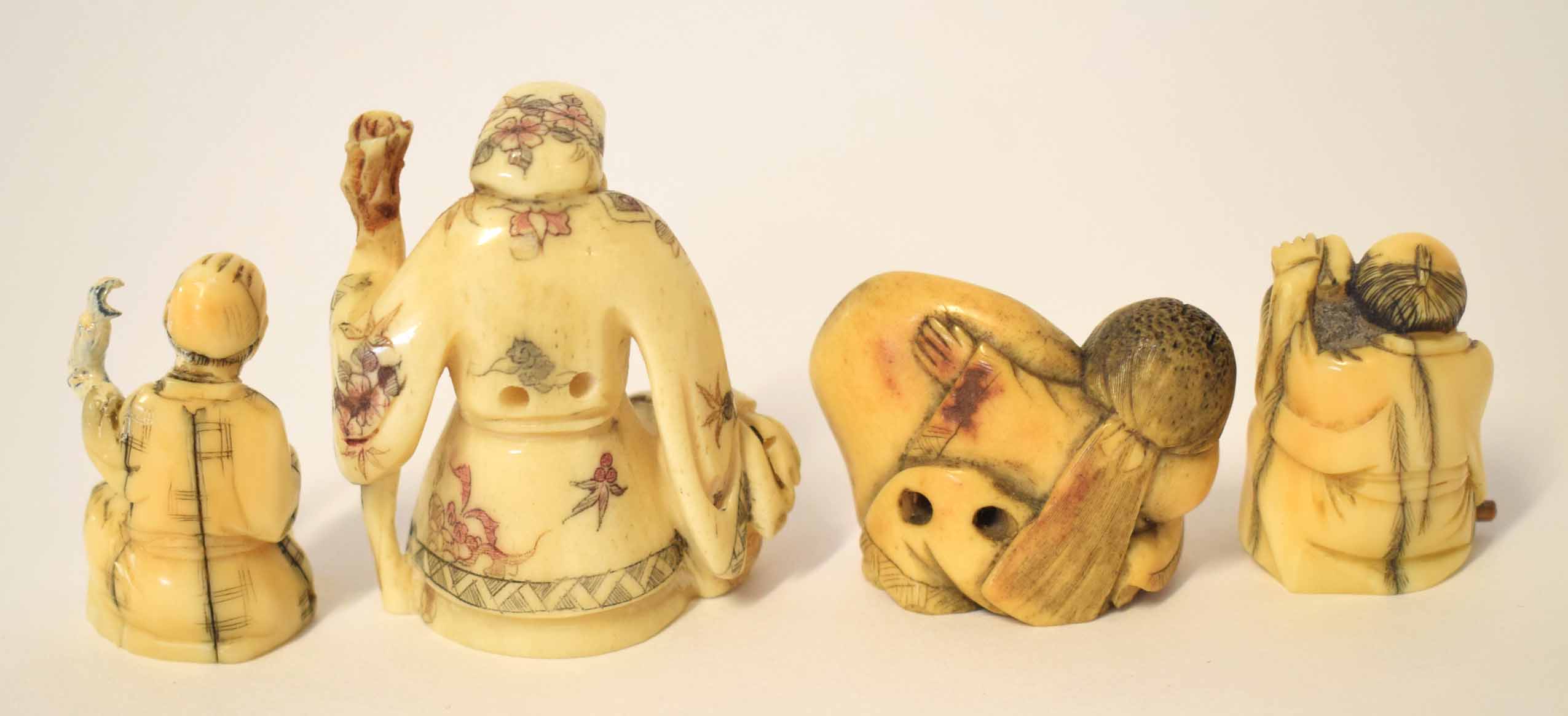 Group of Oriental carvings and netsuke comprising a carving of an immortal with staff plus three - Image 3 of 3