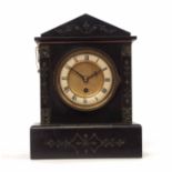 Late 19th century black and variegated marble mantel timepiece, the architectural case on a plinth