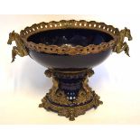 Decorative brass mounted oval centrepiece, applied at either end with cheval handles, the support