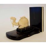 Art Deco bookend with an ivory camel seated on a wooden plinth (the camel a/f), 20cm long