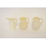 Royal Worcester white glazed porcelain ewer, together with a further white glazed mask jug (a/f) and