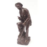 Patinated bronze study of a dandy in early 20th century costume, wearing a double breasted jacket