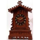 Late 19th century oak cased cuckoo bracket clock, the architectural case with carved and applied