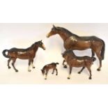 Group of three Beswick horses and a foal, the largest horse 26cm high (4)