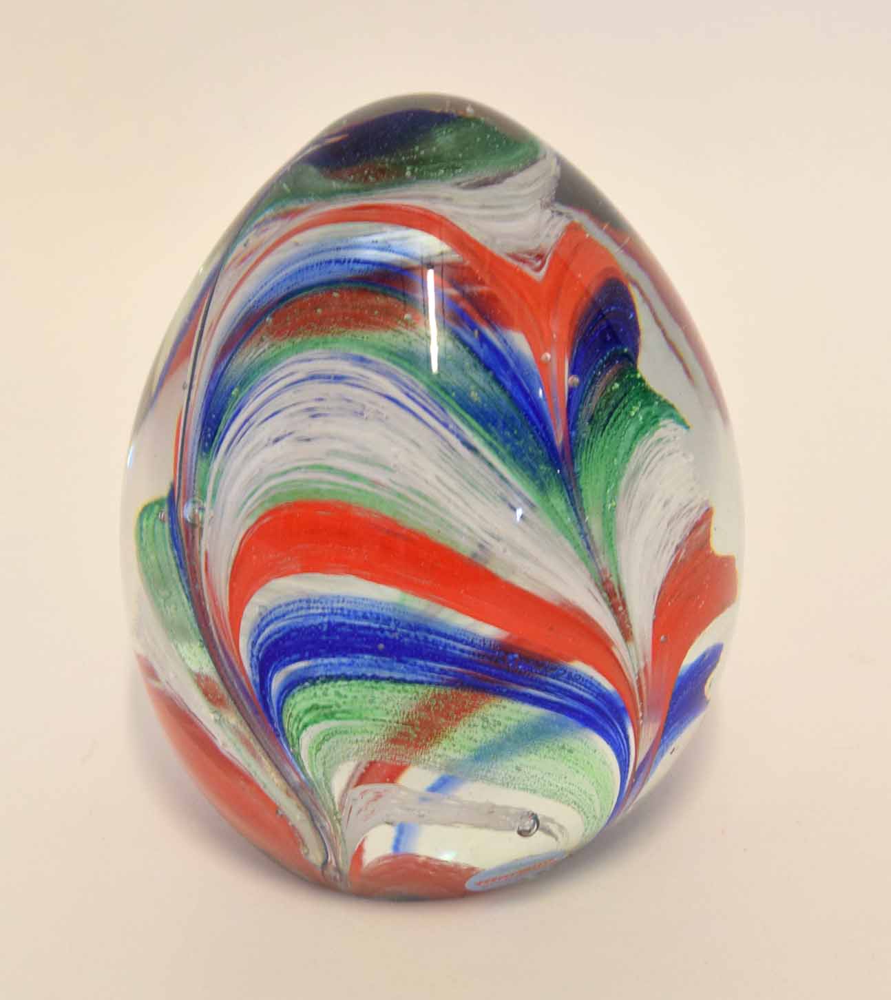 Large Murano glass paperweight, the domed shape with a polychrome swirling design, 16cm high