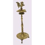 Indian brass table ashtray, crested with temple dog, raised on a twisted stem terminating in a