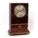 Composite walnut and brass bound mantel clock, the plinth shaped case fitted with a single drawer