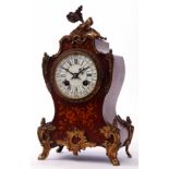 Early 20th century gilt brass and marquetry inlaid mantel clock, the waisted case surmounted by a
