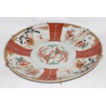 Impressive Meiji period Japanese porcelain charger with polychrome decoration of figures, the