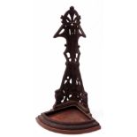 Wall mounting cast iron corner bracket with later mahogany top, height 64cm