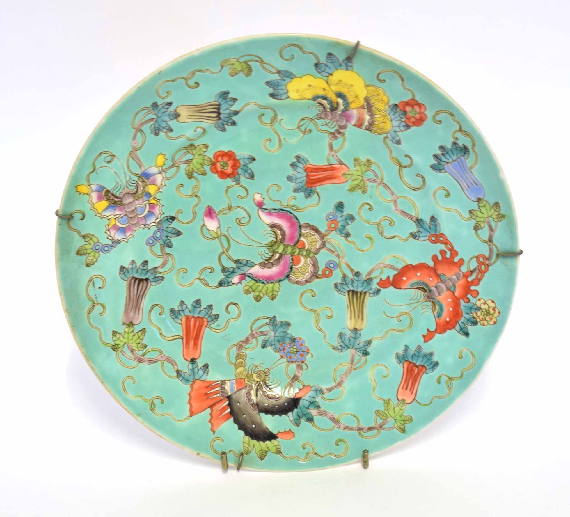 19th century Chinese plate, the pale green ground with polychrome decoration of butterflies and