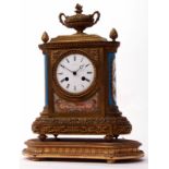 Late 19th century French gilt brass and porcelain mantel clock, the break front case surmounted by