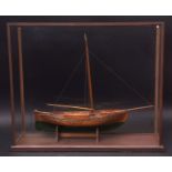 Vintage oak model of a sailing barge with green painted hull, single mast and plain bowsprit in a