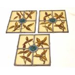 Three matching small leaded glass panels depicting foliate designs, each 25 x 19cm (3)