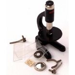20th century child's microscope of black painted finish with Y-shaped foot and pivoting stage and