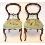 Pair of Victorian balloon back dining chairs with petit point embroidered floral seats