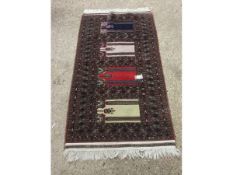 GOOD QUALITY MULTI-GULLED CARPET PREDOMINANTLY IN BROWNS AND REDS