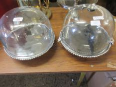 TWO DOMED CAKE DISPLAYS ONE WITH FINIAL ONE WITHOUT