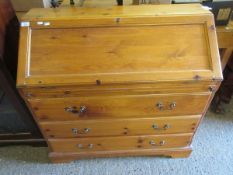 PINE FRAMED DROP FRONTED BUREAU WITH THREE FULL WIDTH DRAWERS WITH BRASS SWAN NECK HANDLES