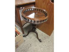 REPRODUCTION MAHOGANY CIRCULAR TABLE WITH GALLERIED EDGE WITH TURNED COLUMN ON A CARVED TRIPOD BASE