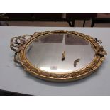 GILT OVAL FRAMED WALL MIRROR WITH RIBBON TOP