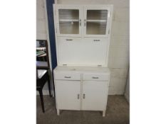 WHITE PAINTED KITCHEN CUPBOARD WITH DROP FRONT WITH ENAMEL TOP FITTED WITH TWO GLAZED DOORS AND