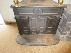 CAST IRON WOOD BURNING STOVE WITH CONCERTINA DOOR FRONT