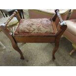 EDWARDIAN WALNUT PIANO STOOL WITH LIFT UP LID AND RAIL SIDES ON SHAPED LEGS