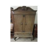 OAK FRAMED FRENCH TWO-DOOR CUPBOARD WITH FULL WIDTH DRAWER TO BASE ON PAD FEET