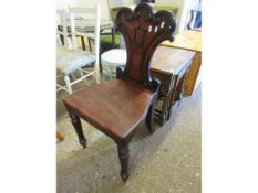 VICTORIAN MAHOGANY HALL CHAIR WITH ARMORIAL CARVED CREST TO BACK ON TURNED FRONT LEGS