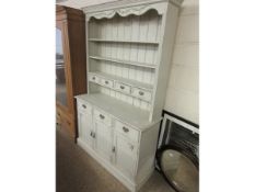 PAINTED PINE FRAMED DRESSER FITTED WITH THREE FIXED SHELVES WITH FOUR DRAWERS THE BASE FITTED WITH