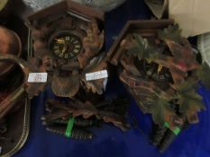 TWO REPRODUCTION CUCKOO TYPE CLOCKS AND WEIGHTS