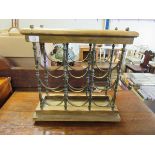 BEECHWOOD AND BRASS FRAMED NINE-SECTIONAL TABLE TOP WINE RACK