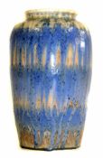 Ruskin vase of slightly tapering circular form decorated in shades of blue and brown to a cream