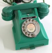 GPO vintage Bakelite telephone in green, model number 312L with paper label "Norwich 860654", with