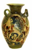 Branum, Barnstaple baluster three-handled vase, incised and painted with stylised fish designs,