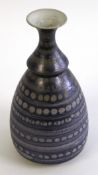 Peter Lane (born 1932), Stoneware baluster vase with a metallic lavender glaze, incised maker's name