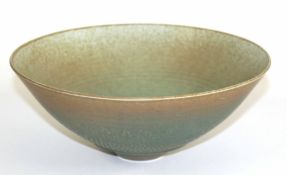 Peter Lane (born 1932), porcelain bowl, stippled decoration in green to an ochre ground, mottled