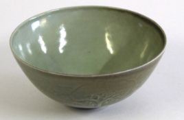 Peter Lane (born 1932), Celadon glazed circular bowl, incised with a continuous woodland scene,