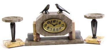 Art Deco period marble clock garniture, the clock of shaped oval form having a gilded dial with