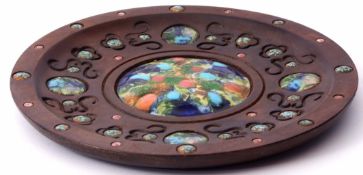 Spanish circular wooden wall plaque or dish with carved detail and applied enamelled plaques to