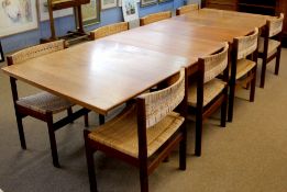 George Petersens mid-century teak extending dining table with eight dining chairs, table with two