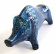 An Italian ceramic sculpture of a bull in blue glaze by Aldo Bitossi 37cm long