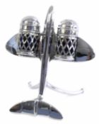 Unusual 1950s chrome cruet set in the form of an elevating jet aeroplane supported on two curved