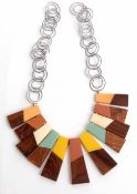 Unusual keyboard collar necklace in teak and coloured perspex with interlocking spiral link chains