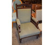 EDWARDIAN WALNUT CARVED FRAMED GENTLEMAN'S CHAIR WITH GREEN STRIPED UPHOLSTERY