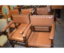 SET OF SIX OAK FRAMED BROWN REXINE UPHOLSTERED DINING CHAIRS COMPRISING A PAIR OF CARVERS AND FOUR