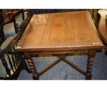 OAK FRAMED DRAW LEAF DINING TABLE ON BARLEY TWIST SUPPORTS AND AN X STRETCHER